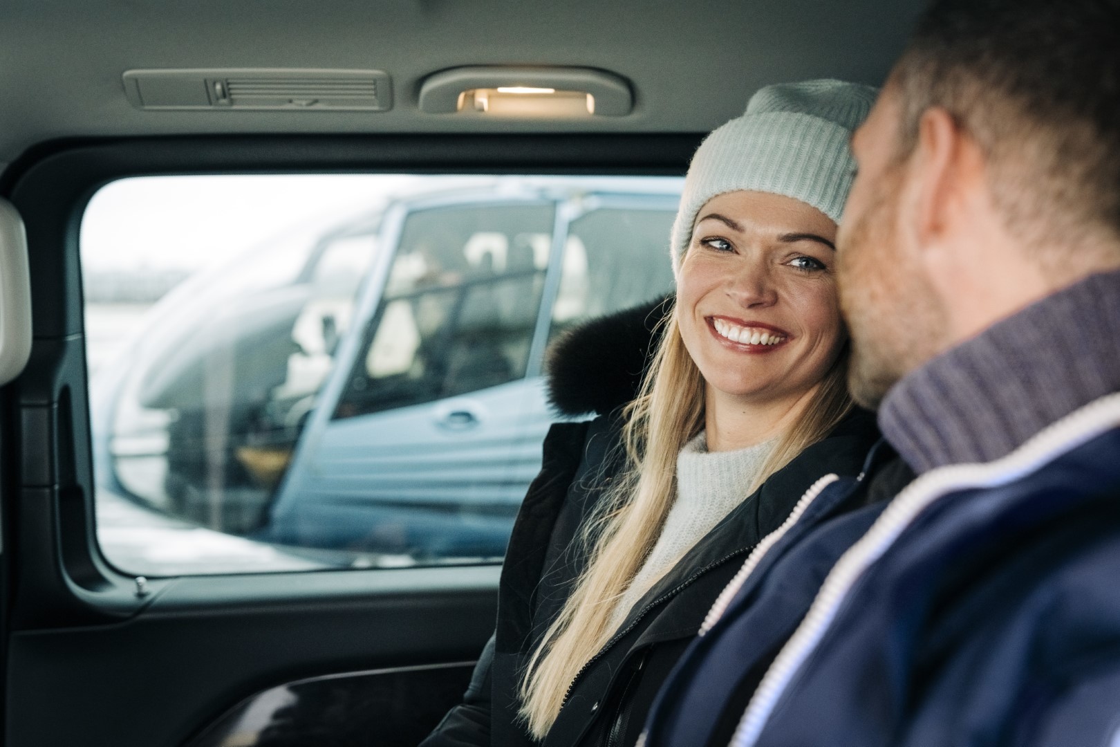 Couple arriving at the airport in car